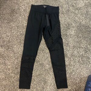Carbon 38 leggings with leg cutouts